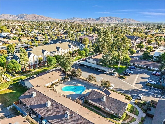 12830 Perris Blvd Unit C10, Moreno Valley, CA 92553 - aerial view of residential area featuring a mountain backdrop and a pool area