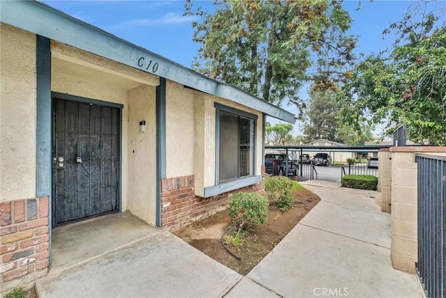 12830 Perris Blvd Unit C10, Moreno Valley, CA 92553 - property entrance with brick siding and stucco siding