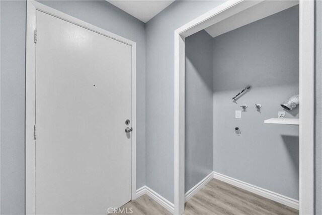 12830 Perris Blvd Unit C10, Moreno Valley, CA 92553 - washroom featuring wood finished floors, baseboards, and hookup for a washing machine