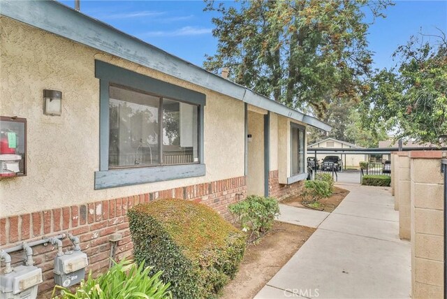 12830 Perris Blvd Unit C10, Moreno Valley, CA 92553 - view of property exterior with brick siding and stucco siding