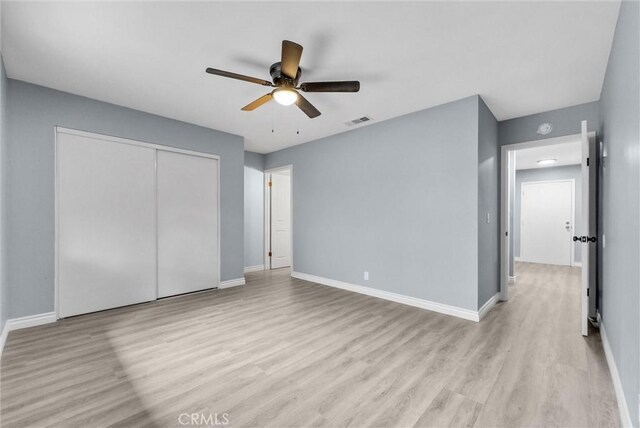 12830 Perris Blvd Unit C10, Moreno Valley, CA 92553 - unfurnished bedroom with light wood-style floors, baseboards, a closet, and a ceiling fan