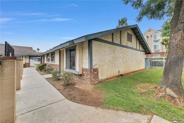 12830 Perris Blvd Unit C10, Moreno Valley, CA 92553 - view of home's exterior with stucco siding and brick siding
