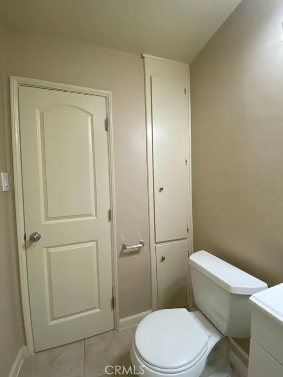 5631 Danny Ave, Cypress, CA 90630 - bathroom with toilet, baseboards, tile patterned flooring, and vanity