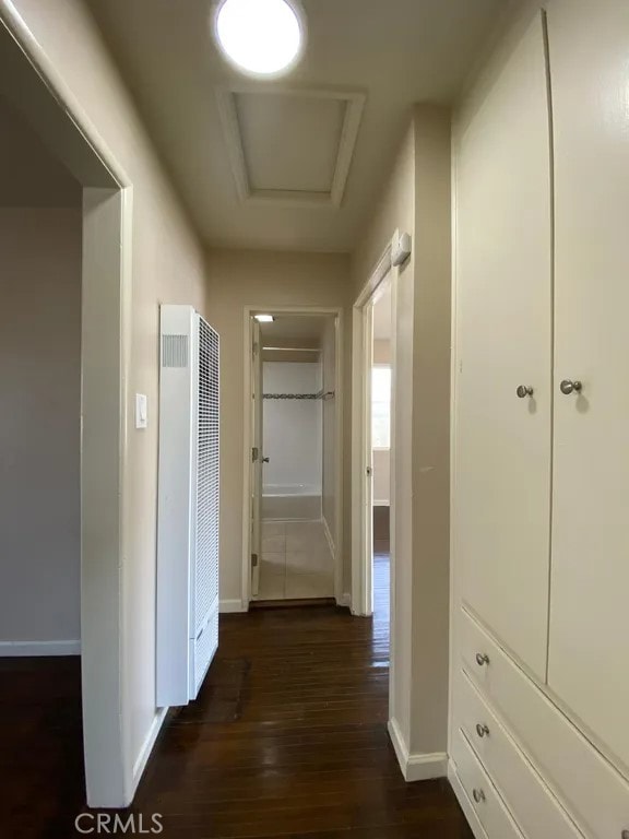 5631 Danny Ave, Cypress, CA 90630 - hallway with a heating unit, dark wood-type flooring, baseboards, and attic access