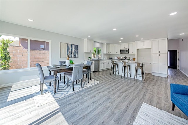 11591 Palawan St, Cypress, CA 90630 - dining area featuring light wood-style flooring and recessed lighting