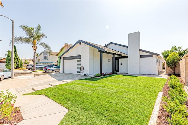 11591 Palawan St, Cypress, CA 90630 - view of front of house featuring an attached garage, concrete driveway, and a chimney