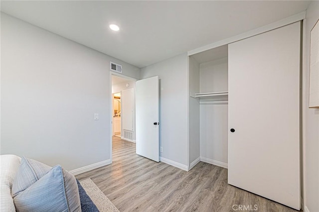 11591 Palawan St, Cypress, CA 90630 - bedroom with light wood-style floors, a closet, and recessed lighting