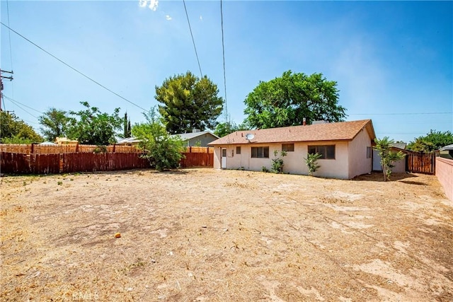 632 E Oldfield St, Lancaster, CA 93535 - rear view of property with a fenced backyard and stucco siding