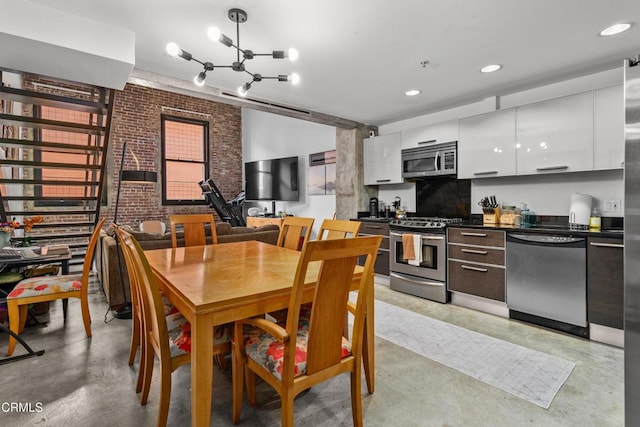 35 N Raymond Ave Unit 210, Pasadena, CA 91103 - dining room featuring concrete floors, a chandelier, brick wall, and recessed lighting