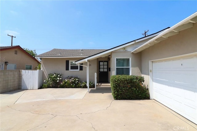 425 E Wilson Ave, Orange, CA 92867 - view of front of home featuring stucco siding and an attached garage