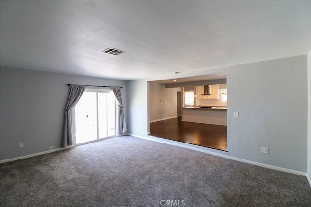 425 E Wilson Ave, Orange, CA 92867 - unfurnished living room with carpet and baseboards
