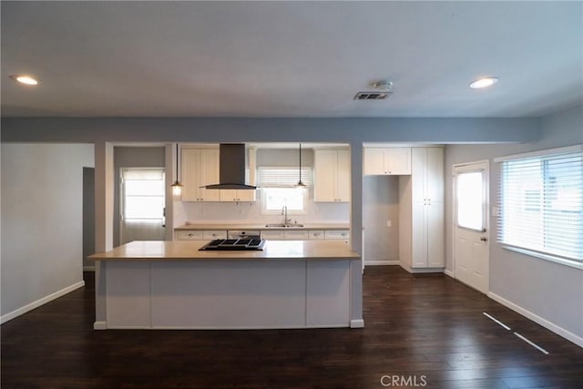 425 E Wilson Ave, Orange, CA 92867 - kitchen with wall chimney range hood, a sink, gas cooktop, baseboards, and recessed lighting