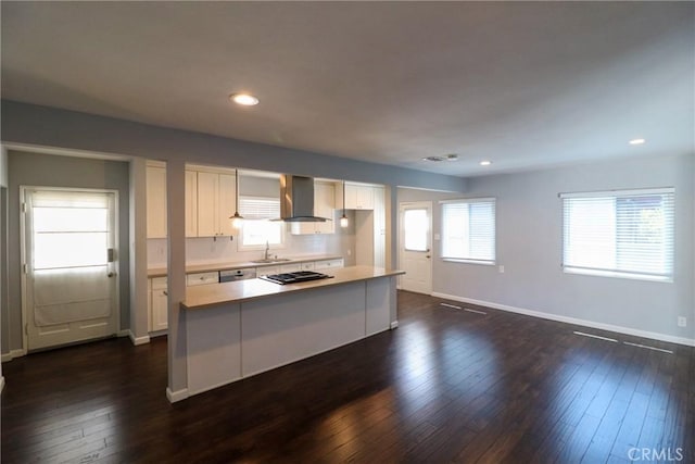 425 E Wilson Ave, Orange, CA 92867 - kitchen with a sink, wall chimney range hood, gas stovetop, white cabinets, and light countertops