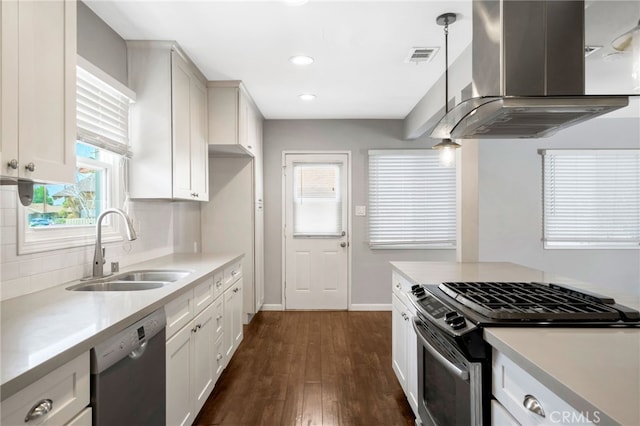 425 E Wilson Ave, Orange, CA 92867 - kitchen featuring island exhaust hood, stainless steel gas range, dishwasher, light countertops, and backsplash