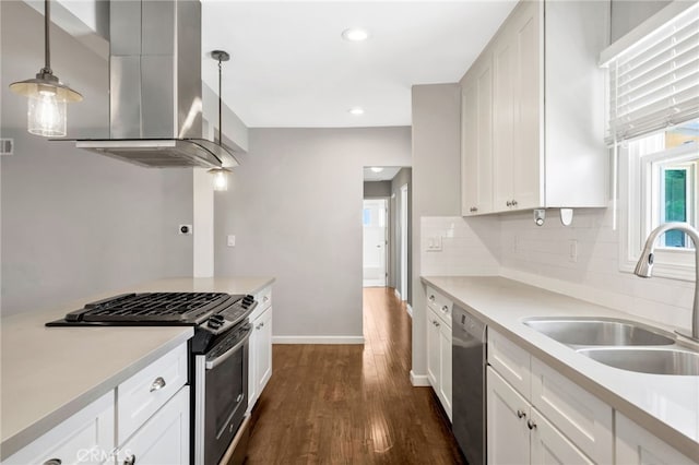 425 E Wilson Ave, Orange, CA 92867 - kitchen featuring appliances with stainless steel finishes, wall chimney range hood, dark wood-type flooring, decorative backsplash, and white cabinets