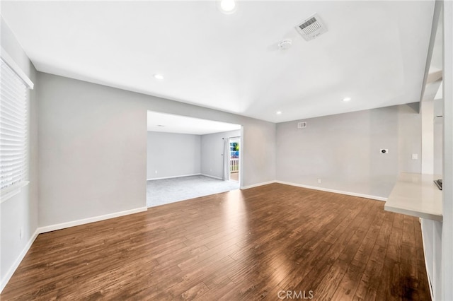 425 E Wilson Ave, Orange, CA 92867 - unfurnished living room featuring hardwood / wood-style flooring and recessed lighting