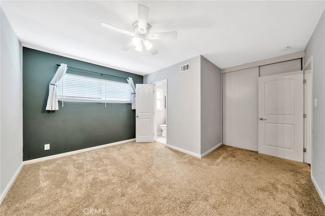 425 E Wilson Ave, Orange, CA 92867 - unfurnished bedroom with carpet floors, a ceiling fan, a closet, and ensuite bath