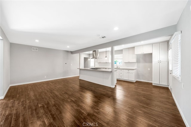 425 E Wilson Ave, Orange, CA 92867 - unfurnished living room featuring dark wood-style flooring and recessed lighting