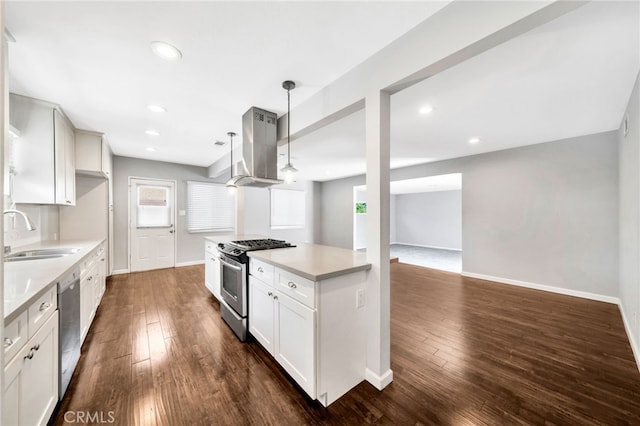 425 E Wilson Ave, Orange, CA 92867 - kitchen featuring stainless steel appliances, island exhaust hood, light countertops, dark wood-type flooring, and recessed lighting