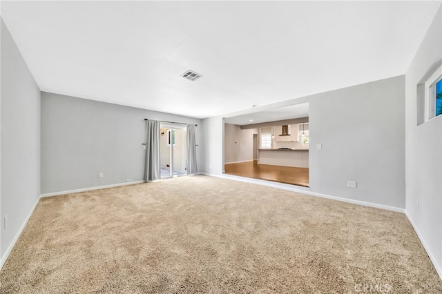 425 E Wilson Ave, Orange, CA 92867 - unfurnished living room featuring carpet floors