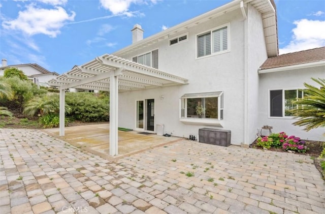 2938 Calle Gaucho, San Clemente, CA 92673 - rear view of house featuring a pergola, a patio area, stucco siding, and a chimney