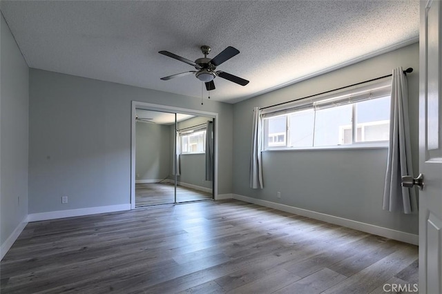 17132 Emerald Ln, Huntington Beach, CA 92647 - unfurnished bedroom with a textured ceiling, a closet, wood finished floors, baseboards, and ceiling fan