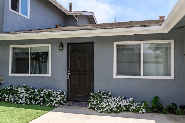 17132 Emerald Ln, Huntington Beach, CA 92647 - view of exterior entry featuring stucco siding