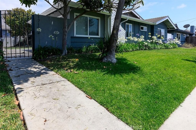 17132 Emerald Ln, Huntington Beach, CA 92647 - view of side of home featuring board and batten siding and a gate