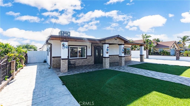 9828 Carob Ave, Fontana, CA 92335 - view of front of house featuring stucco siding and stone siding