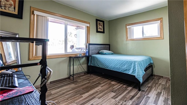 9828 Carob Ave, Fontana, CA 92335 - bedroom featuring wood finished floors and baseboards