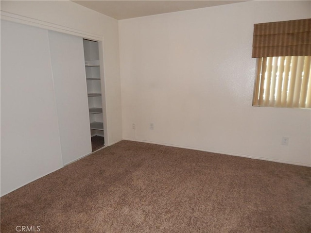 1114 W Blaine St Unit 101, Riverside, CA 92507 - unfurnished bedroom featuring carpet flooring and a closet