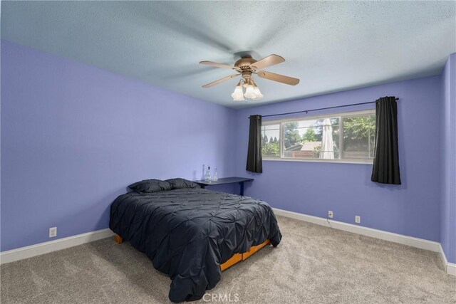 3030 Silverbell Rd, Chico, CA 95973 - bedroom with carpet, a textured ceiling, a ceiling fan, and baseboards