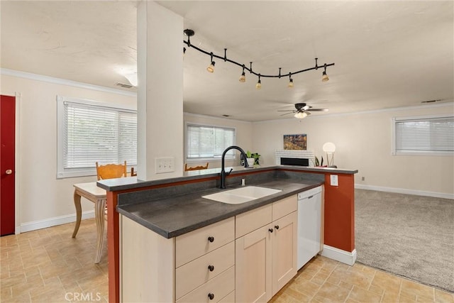 3030 Silverbell Rd, Chico, CA 95973 - kitchen with white dishwasher, a ceiling fan, open floor plan, dark countertops, and light stone finish floors