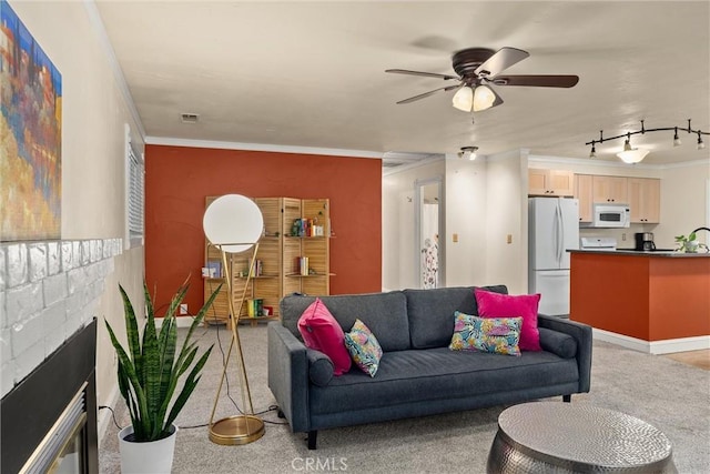 3030 Silverbell Rd, Chico, CA 95973 - living area featuring ornamental molding, light carpet, a ceiling fan, and a brick fireplace