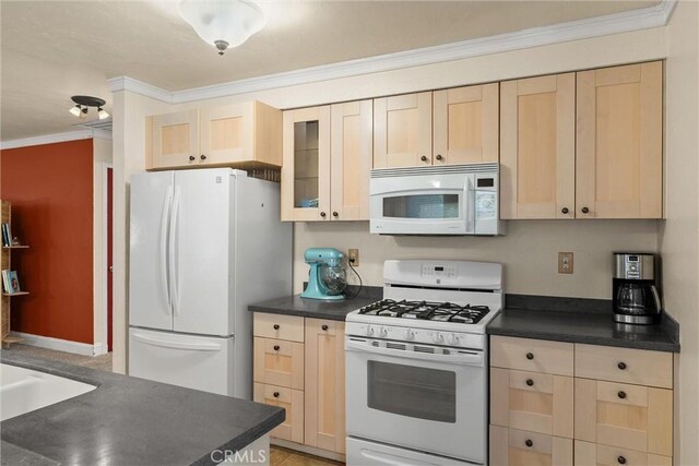 3030 Silverbell Rd, Chico, CA 95973 - kitchen with white appliances, light brown cabinets, dark countertops, crown molding, and glass insert cabinets