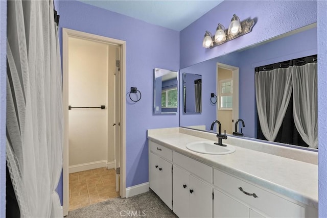 3030 Silverbell Rd, Chico, CA 95973 - full bathroom with vanity, baseboards, and tile patterned flooring