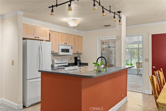 3030 Silverbell Rd, Chico, CA 95973 - kitchen featuring white appliances, dark countertops, rail lighting, light brown cabinetry, and ornamental molding