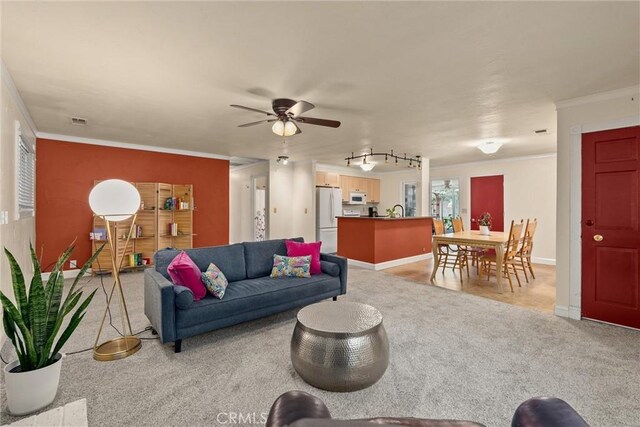 3030 Silverbell Rd, Chico, CA 95973 - living room featuring crown molding, light carpet, and ceiling fan