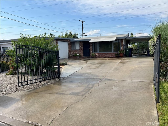 17139 E Newburgh St, Azusa, CA 91702 - ranch-style home featuring driveway, a gate, and brick siding