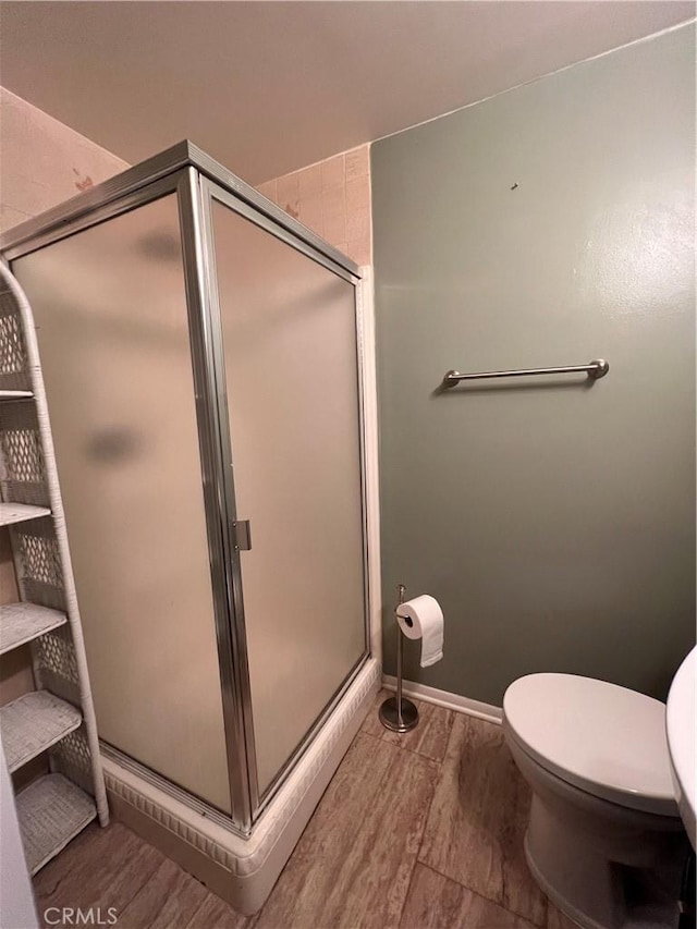 17139 E Newburgh St, Azusa, CA 91702 - full bath featuring wood finished floors, a shower stall, toilet, and baseboards