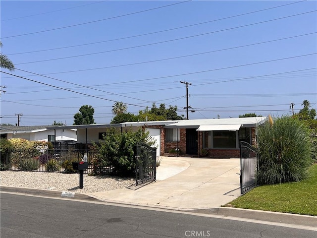 17139 E Newburgh St, Azusa, CA 91702 - single story home with concrete driveway, a fenced front yard, brick siding, and a gate
