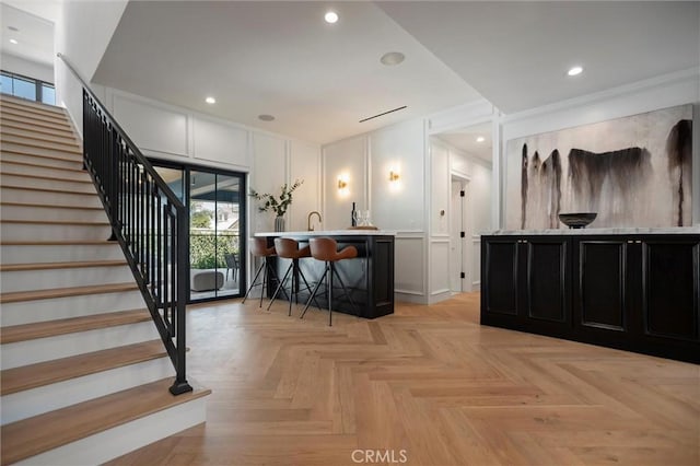 9363 Dinsdale St, Downey, CA 90240 - interior space featuring a decorative wall, stairs, bar with sink, plenty of natural light, and recessed lighting