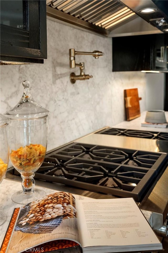 9363 Dinsdale St, Downey, CA 90240 - kitchen featuring dark cabinetry and custom exhaust hood