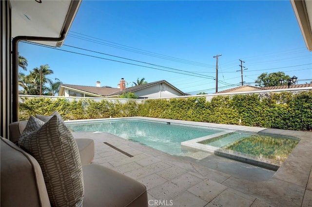 9363 Dinsdale St, Downey, CA 90240 - view of swimming pool featuring a patio area, a fenced backyard, and a pool with connected hot tub