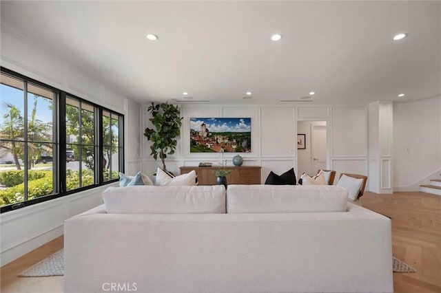 9363 Dinsdale St, Downey, CA 90240 - living area featuring a decorative wall, recessed lighting, and stairs