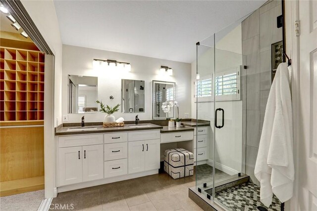 55 Fairfield, Lake Forest, CA 92610 - bathroom featuring double vanity, a shower stall, and tile patterned floors