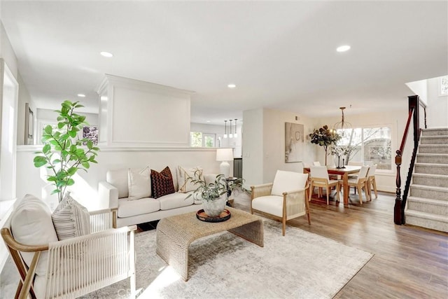 55 Fairfield, Lake Forest, CA 92610 - living area with stairway, light wood finished floors, recessed lighting, and a chandelier