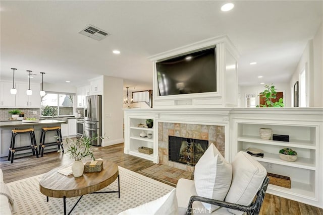 55 Fairfield, Lake Forest, CA 92610 - living room with wood finished floors, recessed lighting, and a fireplace