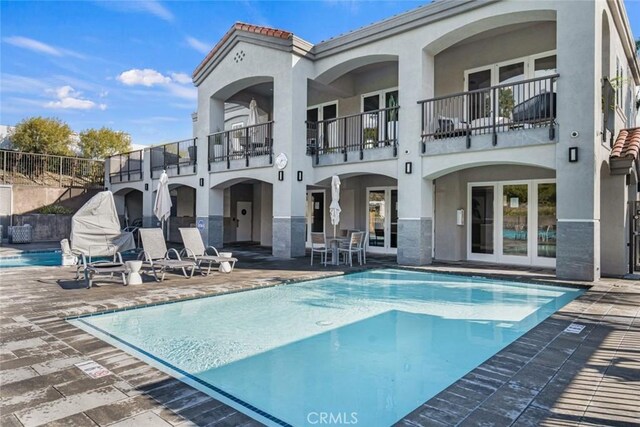55 Fairfield, Lake Forest, CA 92610 - rear view of house with stucco siding, a balcony, and a patio