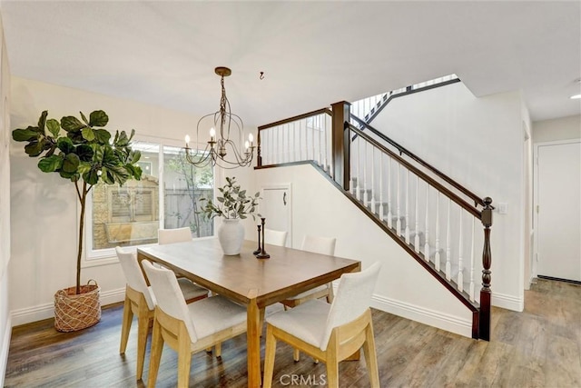 55 Fairfield, Lake Forest, CA 92610 - dining room with wood finished floors, a chandelier, and stairs